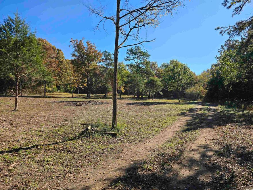 Discover this exceptional 16-acre parcel of vacant land, offering the perfect blend of cleared space and serene woods. Fantastic for Hunting! Approximately 2 acres are already cleared, with the remaining acreage beautifully wooded, ensuring privacy and natural beauty.  This property is truly ready for your dream home or cabin, boasting essential infrastructure already in place: New Well Pump, New Septic Tank, Electrical service, and a RV hook-up!  A desirable building site is waiting for your vision! Enjoy the tranquility of a small creek that runs along the back boundary of the property.  Located conveniently near Iron Mountain, this is an outstanding opportunity for those seeking a weekend getaway or a permanent nature-filled residence or a place to hunt with all the hard work of utility installation already done!  Don't miss this rare, fully-equipped piece of paradise!