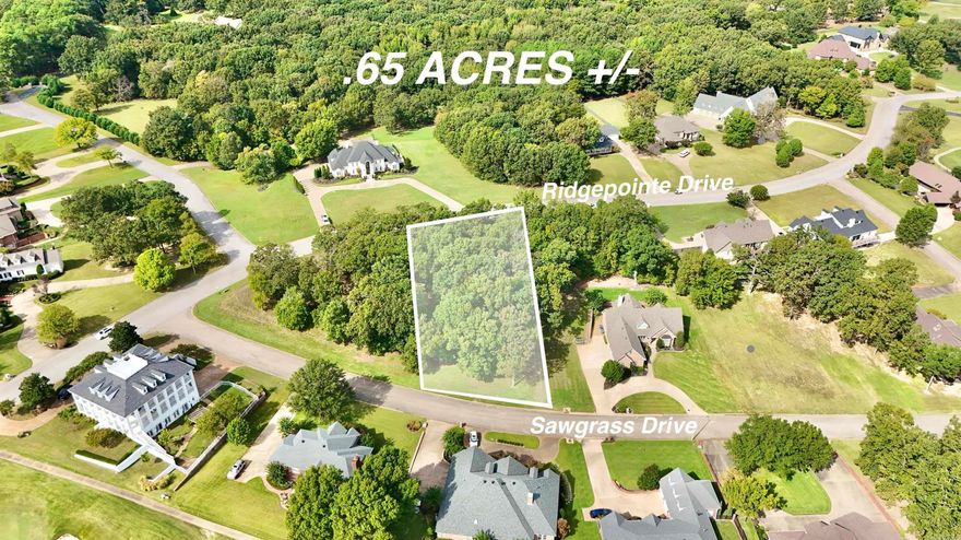 Prime .65-acre vacant lot on the private Ridge Point Golf Course, ideally located beside holes 11 and 14 with dual access from Ridge Point Drive and Sawgrass Drive. Zoned for a single-family home, this lot offers stunning golf course views in a quiet, upscale community just up the road from Ridge Point Country Club. A rare opportunity to build your dream home with premium golf frontage.