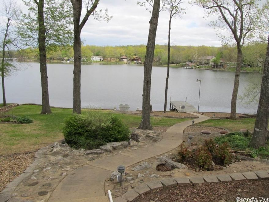This beautiful lake home sits on Lake Sequoyah in Cherokee Village. It has a screened in porch along with a deck that over looks the Lake. The inside of the house has laminate flooring and tile throughout. This home would make for a great place to relocate or even have as a vacation home. The dock offers easy access to the water and great views of the lake. Call today and set up an appointment.