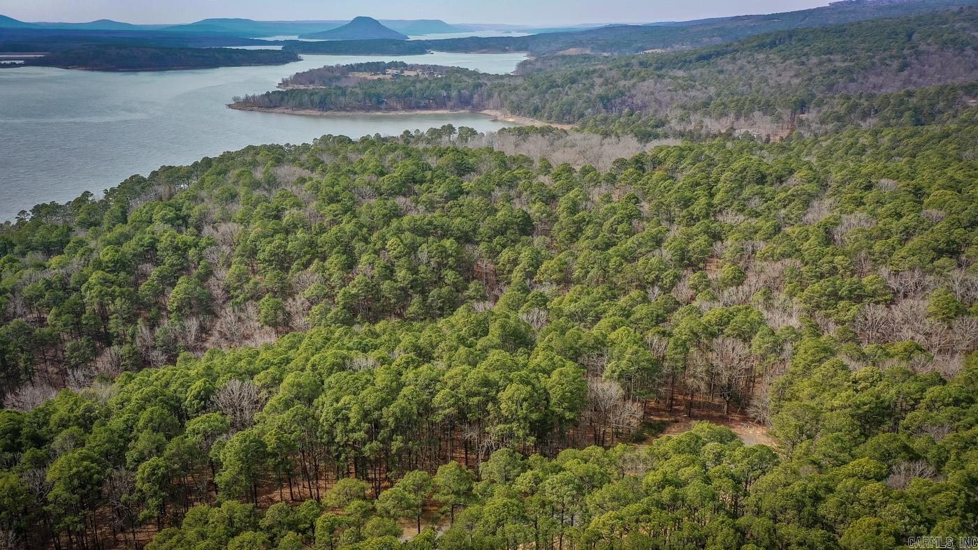 Just what the doctor ordered. Four lakeview/front tracts containing 3 m/l acres. Minimum restrictions and all utilities underground (will need to be perked), including fiber internet. Paved streets, secluded and private feel with all the pleasure's of LAKE LIFE. Don't miss out.