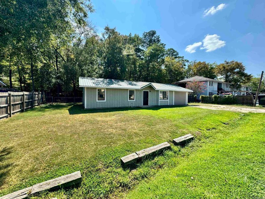 Move in ready!  This property won't last long!  Sitting on a level lot, this home has a detached garage/shop with a fenced back yard and deeded Lake Hamilton launch ramp access! Open feel with vaulted ceiling in living room, fresh paint and new flooring.  Metal roof.  Detached garage/shop has power. Located just off of Central Ave making access to town and shopping convenient.