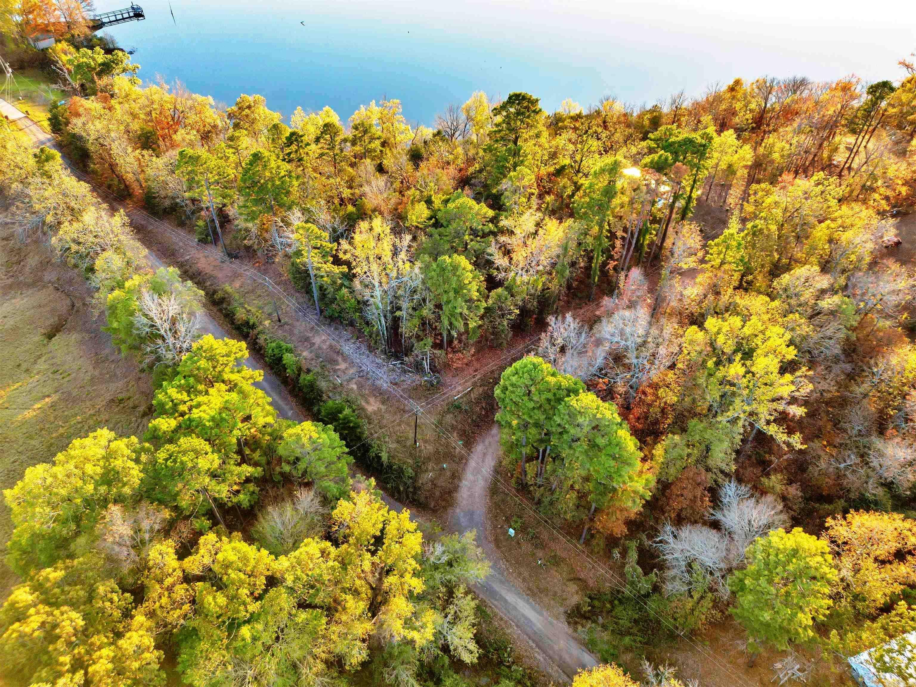 LAKEFRONT PROPERTY 1.57 ACRES FROM HILLTOP ON HARRIS BRAKE LAKE!!! This property has the most amazing view from the hilltop that over looks down to Harris Brake Lake surrounded by mountains and trees. Property goes down to Harris Brake Lake for fun times fishing with friends and family. Great spot for your forever home, vacation home, RV or Modular Home. Utilities available at the road. "NO RESTRICTIONS"