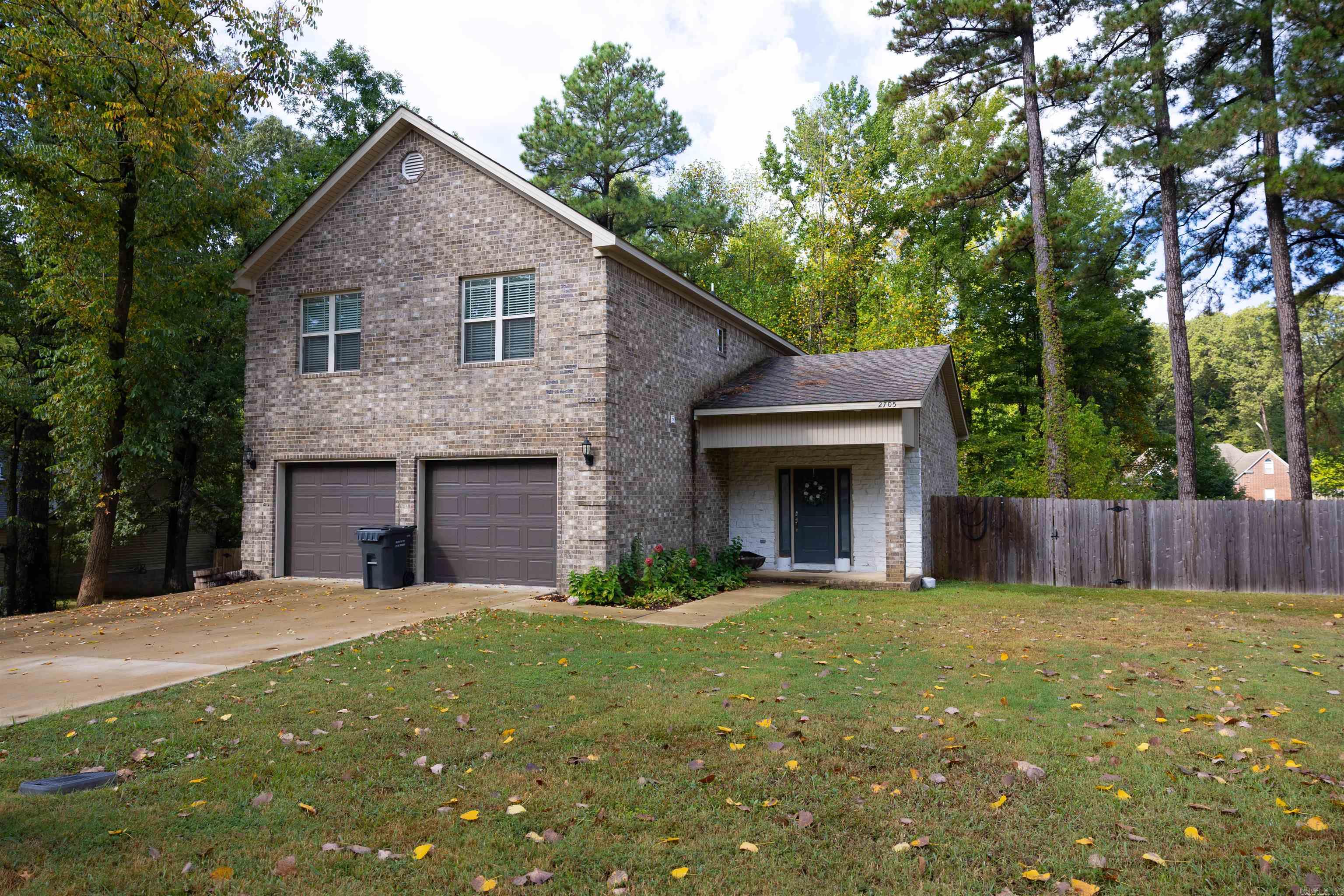 This all brick, 3 bedroom 2 & a half bath home is just minutes from downtown Jonesboro. All three bedrooms are upstairs, along with the laundry room. On the main level you will find an open floor plan. Granite countertops throughout the entire house. The kitchen has a lot of cabinet space and features stainless appliances. The master suite has dual vanities, separate shower and tub, and a huge walk-in closet. In the back yard, there is a nice size deck and plenty of shade trees in the privacy fenced yard. This house has plenty of storage and a nice size garage. Call today for your private tour!