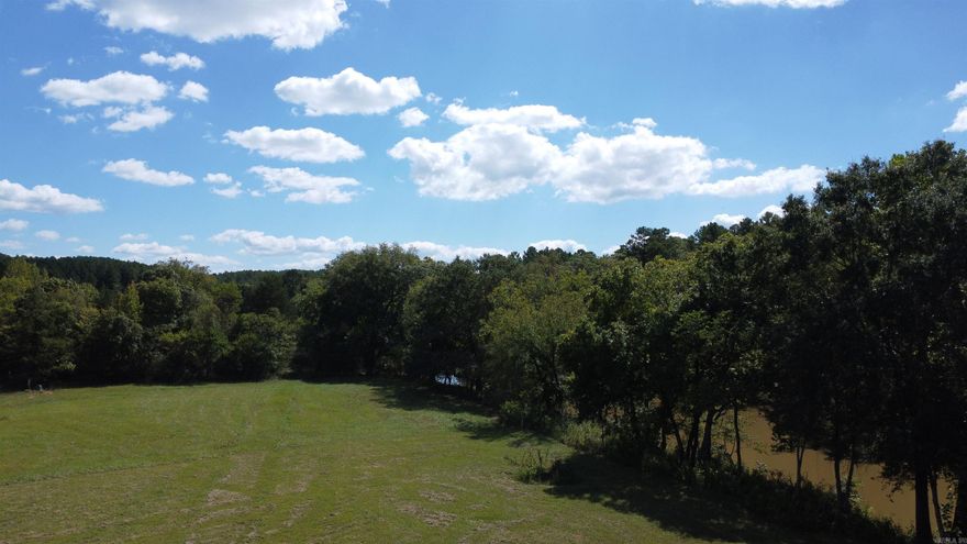 3.01 acres joining Irons Fork Creek in Story AR. It is the last of the lots on Irons Fork Creek. Located in a quiet little community called Reva's Retreat which is completely surrounded by Ouachita National Forest. This creek has water year round with good fishing and this lot has 288 feet of creek frontage. There is a common area for use of all property owners. Underground electric is already available. Well and septic will need to be installed. Flood plain study is included. This property is about a mile to our beautiful Lake Ouachita. Give a call today for your private tour.