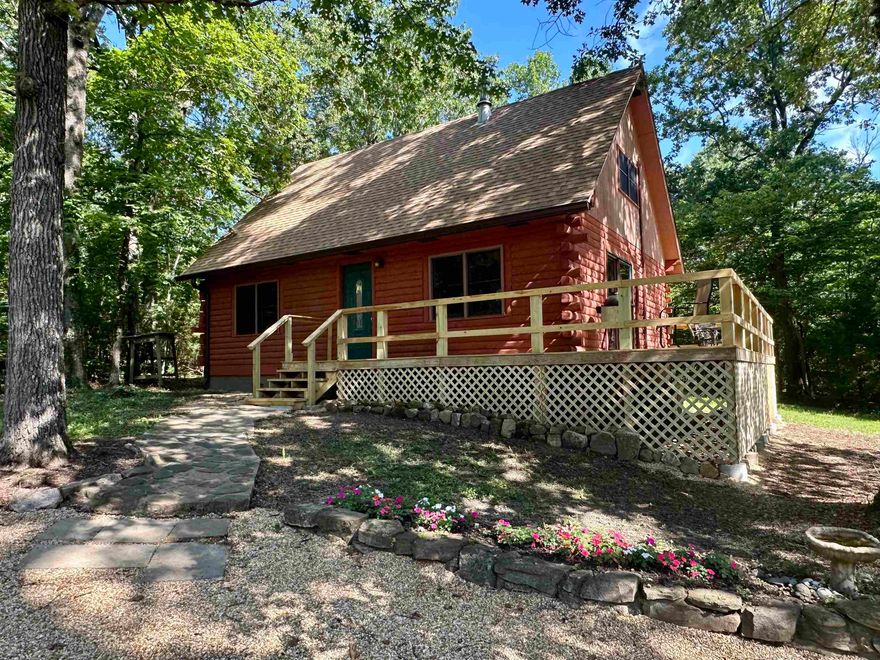 Charming 2-Bedroom Home on 3.29 Acres – Minutes from Bull Shoals Lake!  Welcome to your peaceful retreat just 5 minutes from Bull Shoals Lake access! This beautifully updated 2-bedroom, 1.5-bath home sits on a private 3.29-acre lot and combines modern upgrades with cozy comfort.  Inside, you'll find a warm and inviting living space featuring a HearthStone wood stove—perfect for relaxing evenings and efficient heating throughout the cooler months. The home has been thoughtfully updated in 2025 with a new bathroom, stainless steel appliances, water heater, and new roof with seamless gutters, offering both style and peace of mind.  Step outside to enjoy the large deck, ideal for entertaining or simply taking in the natural surroundings. A detached garage/shop provides tons of storage space and room for projects, hobbies, or outdoor gear.  Whether you're seeking a full-time residence or a serene weekend getaway, this move-in-ready property offers privacy, modern comforts, and quick access to one of the area’s most beautiful lakes. Don’t miss this one!