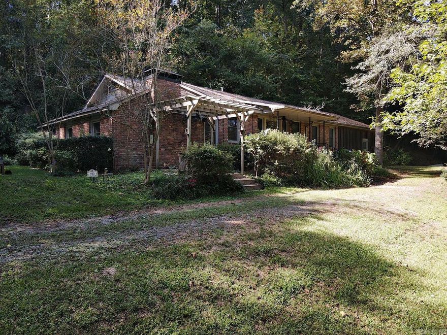 Hidden gem in secluded location! This 3 bedroom 2 bath home with updated kitchen, heated floors in master bath, encapsulated crawlspace and large workshop.  Beautiful home nestled in on a quiet street with mature trees facing the Ouachita River.  Fall and winter river views from front porch and living room.  Steps away from the Ouachita Baptist University campus and walking trail that ends at the Ouachita River.