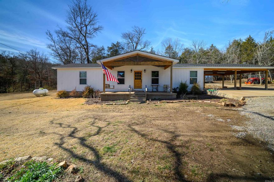 Country living awaits in this completely remodeled home, conveniently located between Batesville and Cave City, Arkansas. No detail was overlooked during the renovation, which included taking the home down to the studs and rebuilding it from the ground up. The home features an open-concept living and kitchen area, two spacious bedrooms, and an oversized bathroom. A bonus heated and cooled attached room provides flexible space ideal for a home office, craft room, or additional living area. Outside, you'll find a large, covered carport and a detached shop building, offering plenty of storage and workspace. A paved county road leads directly to the property, adding to the convenience of this beautiful rural setting. Schedule your private showing today.