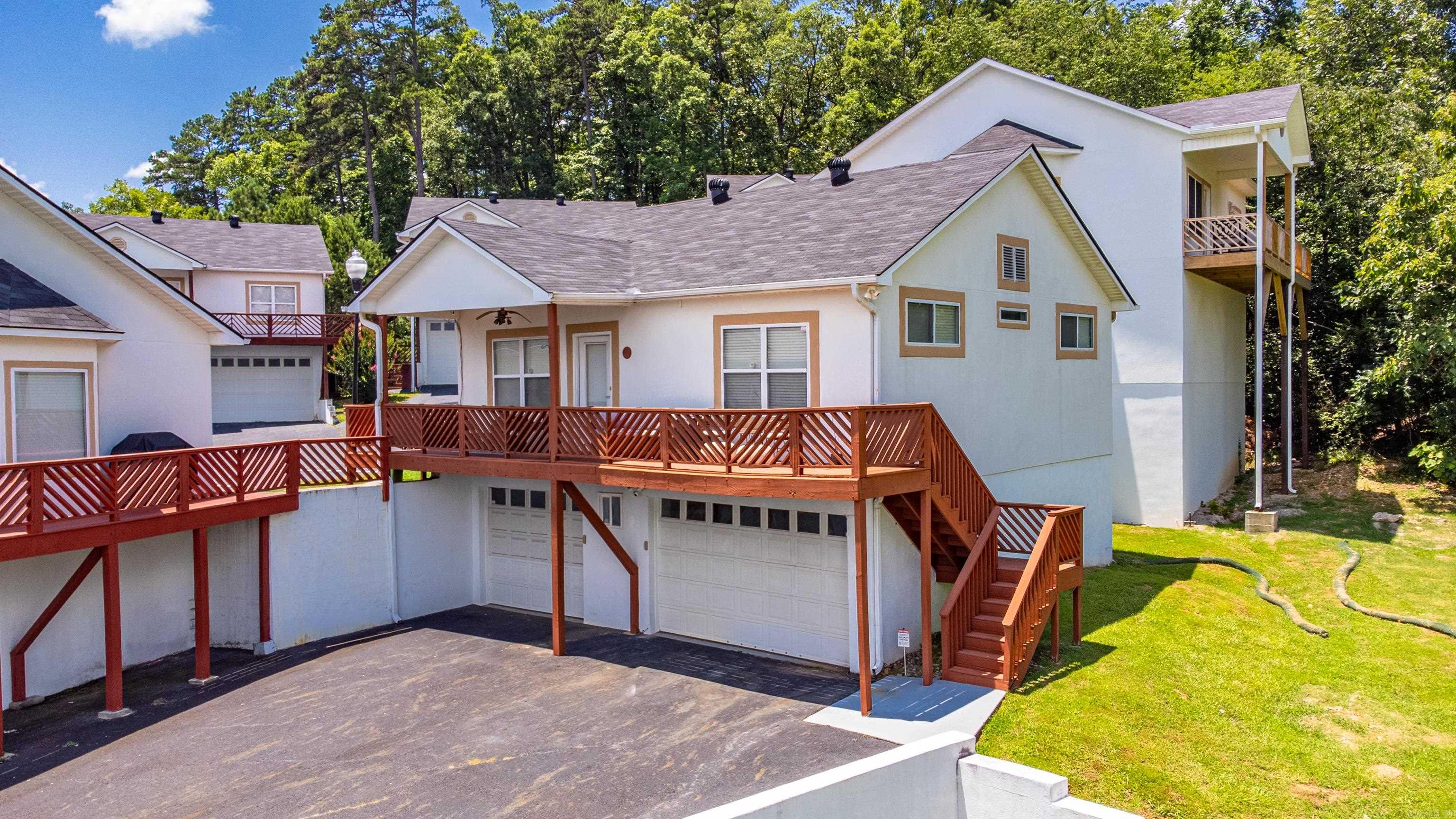One of a kind 2 BR/ 2 Bath condo in a gated community thatās on the lake! Youāll love the spacious pool, outdoor cooking area and swimming dock. This unit represents 5% of the complex. Features a large new maintenance free composite deck and has 2 parking spaces. Itās one of only 2 of the larger units that you can access both the garages on the ground floor, as well as the living area from the ground floor since itās built on the edge of the hillside. All of the other newer stand-alone units, you have to either walk upstairs in the garage or on the outside deck to the 2nd floor to access the living space. This is one you don't want to miss as it is a rare gem. Come See!! See Agent Remarks for gate code. See Associated Documents for a complete list of upgrades.