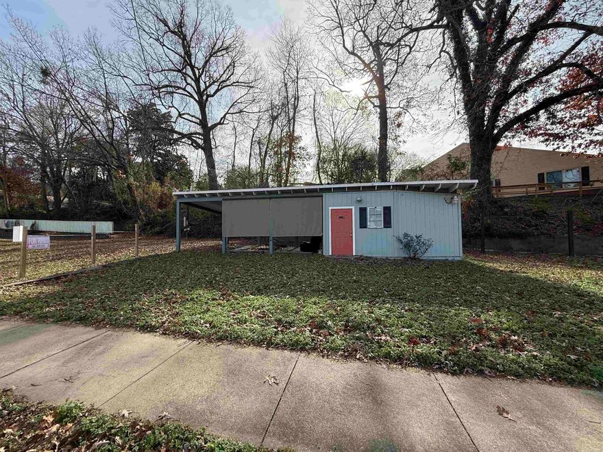 Prime Commercial Opportunity!  Located in a Commercial Transitional zoning district, this unique property offers an outstanding opportunity for entrepreneurs and investors alike. The City of Hot Springs has approved the site for development and operation of a mobile food concession business, allowing up to four food trucks or trailers on the property—providing immediate income potential.  The property features an on-site office with restroom, ideal for management, vendor support, or customer use, along with a covered area that enhances functionality and customer comfort. Positioned along a well-traveled corridor, the location offers excellent visibility and accessibility while remaining flexible for a variety of commercial uses consistent with transitional zoning.  Whether you’re looking to establish a food truck park, expand an existing mobile food concept, or invest in a city-approved commercial site with built-in infrastructure, 910 Park Ave delivers a rare, turnkey opportunity in the heart of Hot Springs.