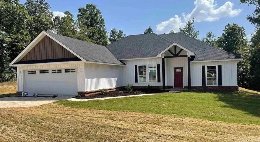 Beautiful home situated on a one-acre lot in the Bauxite School District. This property offers a great open, split floor plan with a cozy fireplace in the living area. The kitchen features a large breakfast bar with granite countertops, a breakfast area, and a formal dining room. Spacious primary suite with a huge walk-in closet. Enjoy the covered back porch overlooking a private backyard. USDA loan eligible.