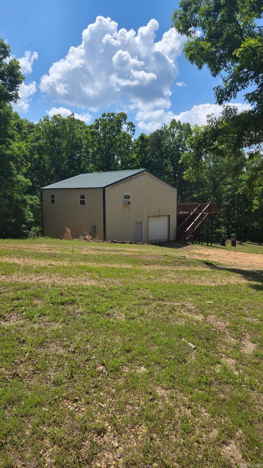 Make it your own retreat in the country. Over six acres just outside of town with a shop house, pond, trees and plenty of deer. Whether you are looking for a quiet get away, hunting spot or future build site, this place has potential.