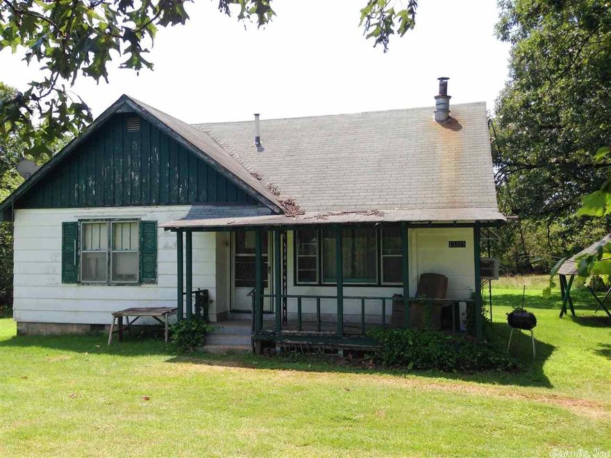 REDUCED TO $22,000!!  2 LEVEL ACRES m/l on busy Highway 63 South in Hardy AR-Older home 3 bed (could be 4) 1 1/2 bath, basement, wall gas heat, window air,  home needs repairs but has tons of potential but will require cash due to repairs needed. Detached garage with concrete floor.  Private well.  #1988