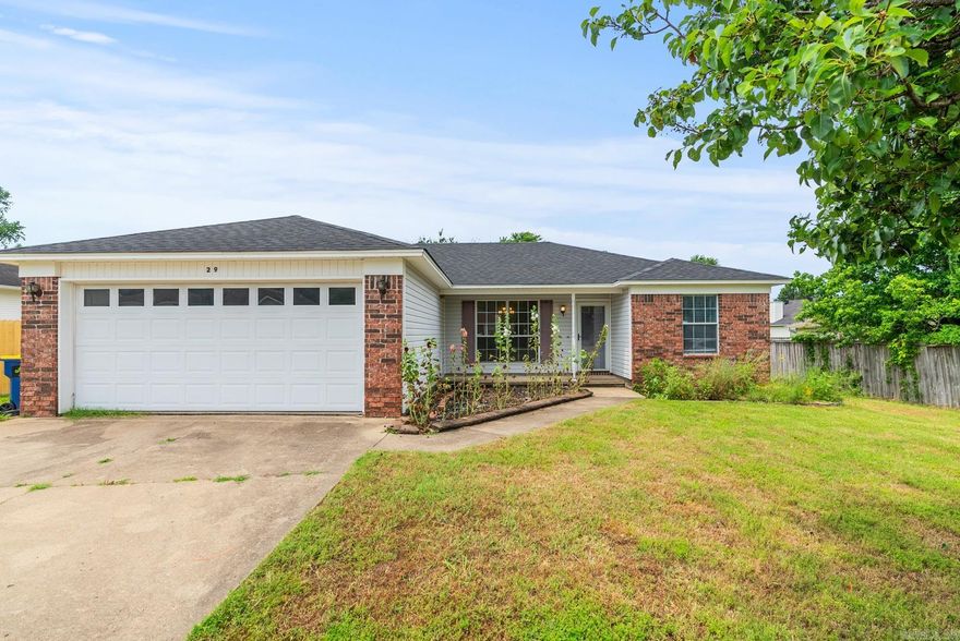 Arrive at Azalea Drive. Tucked into a quiet subdivision, this home blends tranquility with convenience, just moments from schools, eateries, and shopping. As you step inside, the glow of hardwood floors leads you through the space. The kitchen, boasting ample counter space and storage, features a bright dining nook overlooking the yard. Beyond the kitchen, the living room offers comfort with its cozy fireplace and stylish tray ceiling. The home's layout smartly separates two guest bedrooms and a bath from the serene primary suite, which includes a generous walk-in closet and private bath. Step outside to a spacious, fenced backyard, ideal for relaxation or play. With recent upgrades like a NEW Roof May 2024, HVAC 2023, updated garage door, included fridge, and recently repainted living room, this home is ready to welcome you. Experience the blend of peace and practicality in this delightful residence.