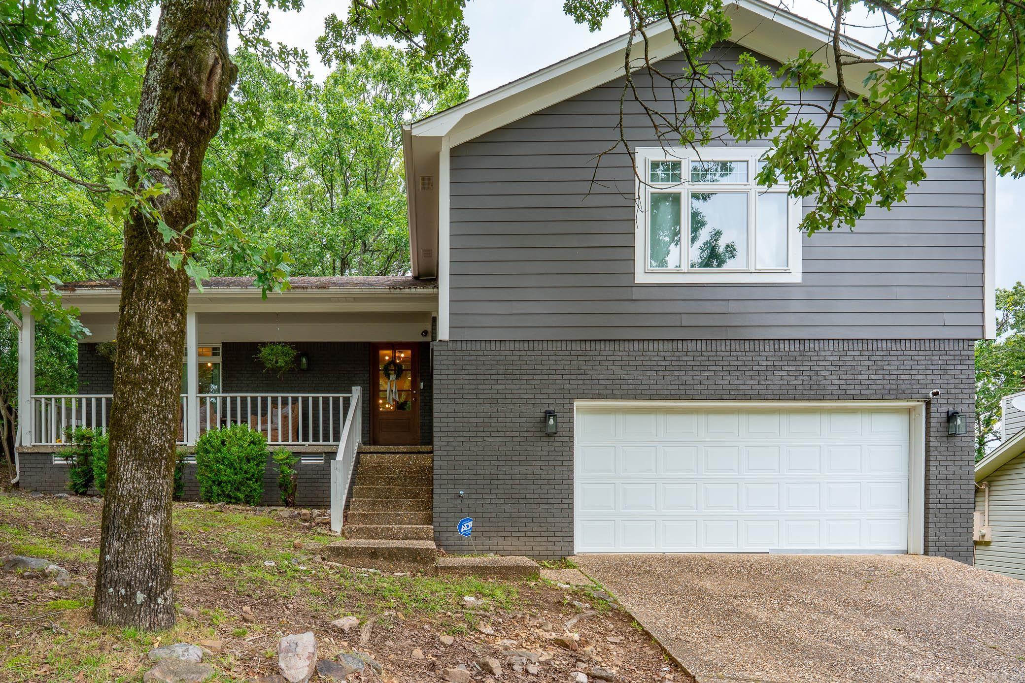 Beautifully updated tri-level home in the heart of west Little Rock is a must see! Main level feautures an open concept floor plan with a formal dining area, living area and kitchen with custom shaker cabinets, large farm house sink, marble countertops and spacious island for extra seating. The downstairs den area features a gas fireplace, wet bar area, half bath and access to the outside patio. Upstairs level features 3 bedrooms, 2 full bathrooms and separate laundry room. Primary suite has a free standing tub, separate shower and floating vanities. Large fenced backyard with spacious deck for entertaining! New lighting & fans, new garage door, interior & exterior paint 2023, new Hardie board siding 2020, windows 2019, HVAC 2020, Roof 2018, Water Heater 2024, added Insulation in crawl space 2025!