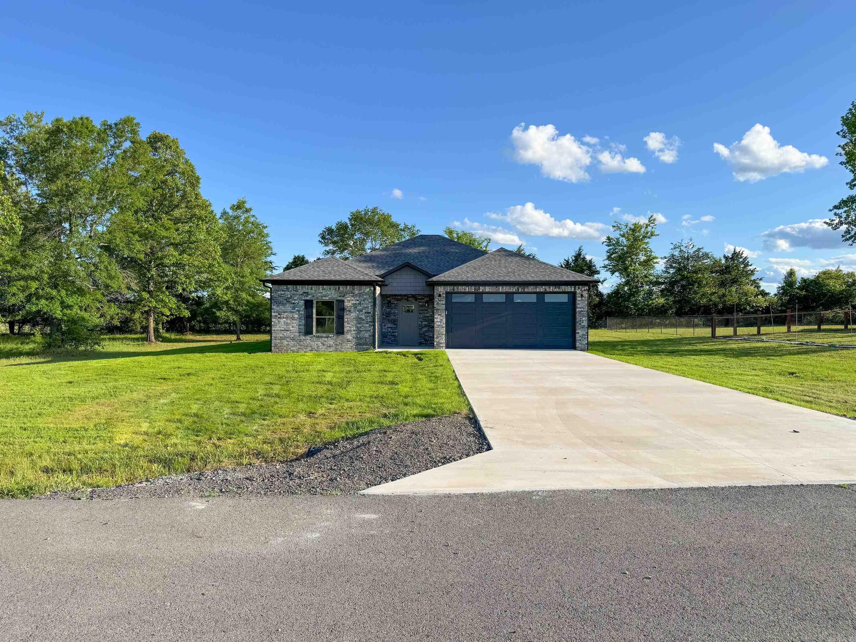 Beautiful new construction in Quitman! Brick home with attached 2-car garage on large lot. Vaulted living room ceiling with recessed lighting, luxury vinyl plank flooring throughout. Kitchen with quartz countertops and pantry. Spacious dining area with a back door that leads out of the dining area and onto a built-in covered porch. Split floor plan with master suite apart. Great location, not even a mile from school and super easy access to Hwy 25 for travel to Conway.