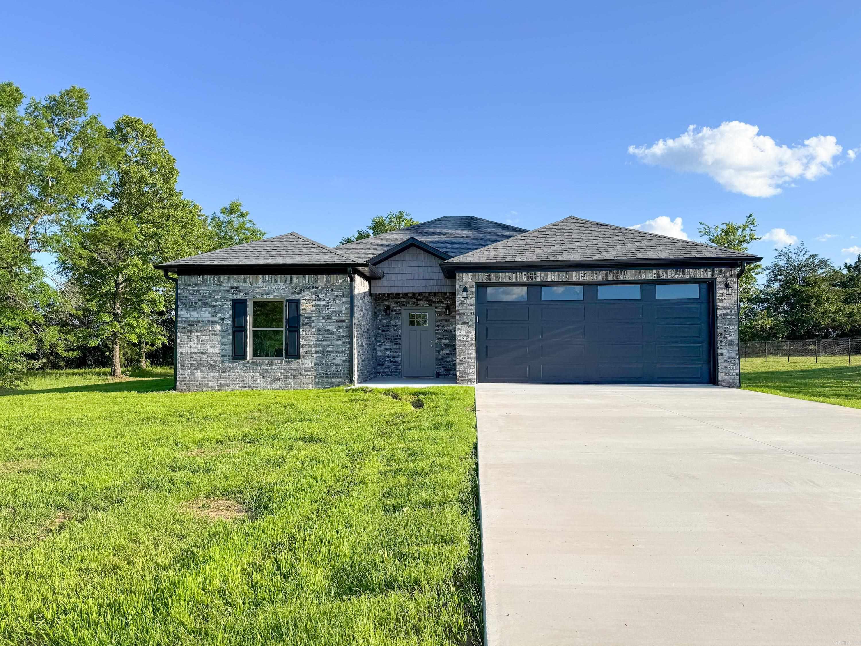 Beautiful new construction in Quitman! Brick home with attached 2-car garage on large lot. Vaulted living room ceiling with recessed lighting, luxury vinyl plank flooring throughout. Kitchen with quartz countertops and pantry. Separate laundry room and spacious dining area. Back door leads out of the dining area and onto a built-in covered porch. Split floor plan with master suite apart. Great location, not even a mile from school and super easy access to Hwy 25 for travel to Conway.