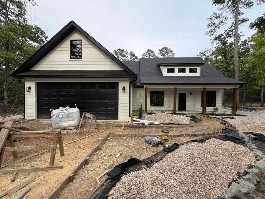 Brand New 2026 Construction. Welcome to this beautifully crafted 3-bedroom, 2.5-bath home located in the highly desirable Fountain Lake School District near the Glazypeaux gate of the Hot Springs Village. Thoughtfully designed for modern living, this brand-new construction offers both style & function with upscale finishes throughout. Step inside to an open-concept floor plan that flows seamlessly through the living, kitchen, and dining areas—perfect for entertaining or everyday life. The spacious living area features an electric fireplace that adds both charm & comfort. The kitchen is a standout, equipped with a large slab granite island & abundant counter space.  The kitchen/dining combo allows for effortless meals & gatherings. The split-bedroom layout ensures privacy, with primary suite offering a serene retreat. Enjoy his-and-her vanities with granite countertops, a luxurious oversized walk-in shower, & custom walk-in closets complete the suite. More pictures to come. Call today to schedule your private showing!