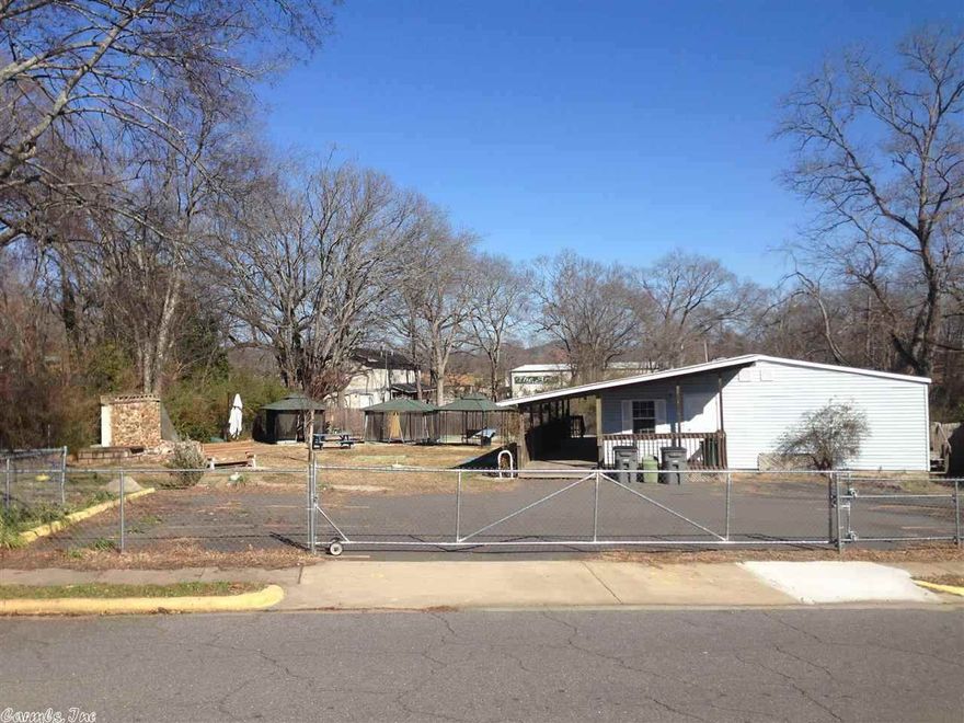 Great Custom built Manufactured Building for commercial business. Completely  Network ready! 5 Large rooms {offices} Large Kitchen,  2 bathrooms, Would be great for Daycare with nice completely fenced in lot with park type atmosphere. Wonderful paved parking lot. Nice covered deck around building. Centrally located. Great Property, Great Price!!!! So many possibilities with this Property!!!