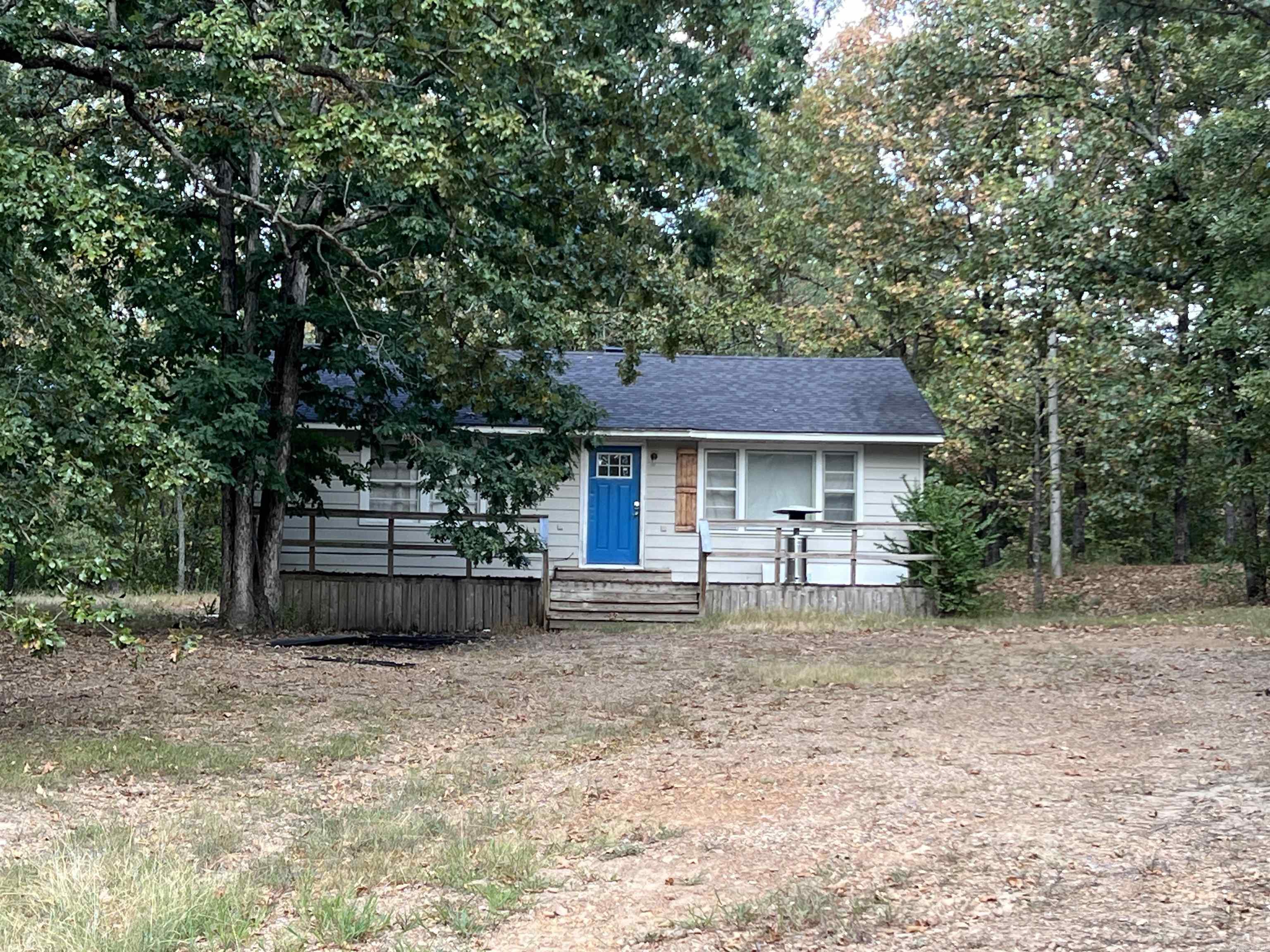 Hard to find 5 acres on Round Mountain. Some trim and drywall work would make this a really nice cottage tucked away in the woods. Amazing opportunity to make this your own private get away at an affordable price. Sold As-Is. No repairs. Has been investment property for last two years. No property disclosure available. HVAC is not functioning at this time. Septic pumped 2023. Some work done in crawlspace to raise and level. New front door and frame. Other improvements include new ceiling fans/light fixtures and some new windows.