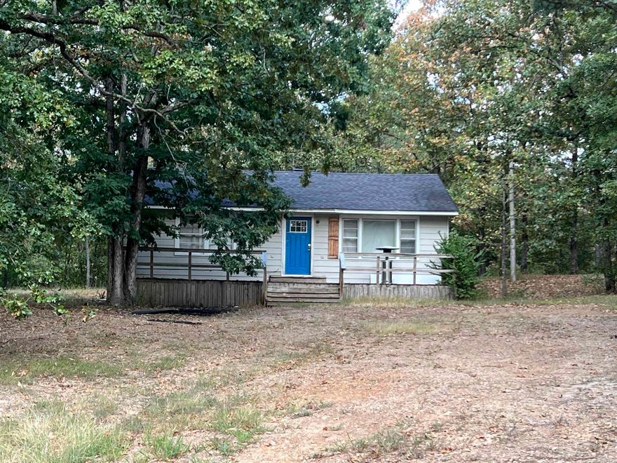 Hard to find 5 acres on Round Mountain. Some trim and drywall work would make this a really nice cottage tucked away in the woods. Amazing opportunity to make this your own private get away at an affordable price.   Sold As-Is. No repairs. Has been investment property for last two years. No property disclosure available.   HVAC is not functioning at this time. Septic pumped 2023. Some work done in crawlspace to raise and level. New front door and frame. Other improvements include new ceiling fans/light fixtures and some new windows.