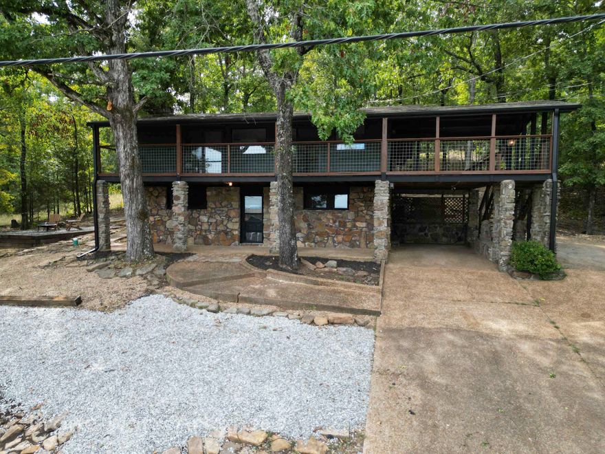 LAKEVIEW OF GREERS FERRY LAKE!  Enjoy the FULL RENOVATION TOP TO BOTTOM in this home with over 2600 sqft. on two levels. (Approx. $120/sq ft. is a super price and value!)  Everything is new & completed 9/24.  Flooring, kitchen & new appliances, bathrooms, decking, paint in & out.  2 upstairs bathrooms are updated with modern features.   Roof in 2018, gutters in 2023.  Two fireplaces.  3 BR, 2 BA, greatroom, laundry on main level, and a den/game room, 1 BR &1  Ba in lower level. Beautiful NEW decks with tile flooring.  Main deck is 36' x 6', with other outdoor dining space.   Large Firepit and sitting area. Landscaping is a work in progress.  Awesome space indoors to accommodate your family & guests.  Potential to use as Short-term rental, and current Owner has a Permit.  Basement is partially finished and has 1034 sq. ft of clean storage space.  Carport plus extra parking pads.  Enjoy all of the Resort amenities.  This home has a private septic system, so no sewer fee!  Call for info on Resort Community dues and service fees.