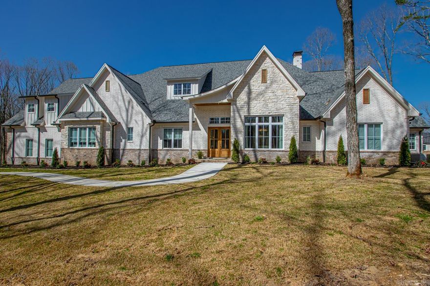 There are way too many things to say about this home!   It is in one of the newest gated subdivisions in Saline County Big Rock Estates.  This 4- acre gem is at the end of the cul-da-sac and nestled up to a green space with a beautiful creek.  The house has everything you could imagine.  Tons of space to entertain, 20x50 saltwater pool, eat in kitchen/living with Calacatta Matarazzo marble, Carra Marble throughout all the bathrooms, Emtek crystal door knobs, 60" dual fuel Thermador range, Thermador oven, and 2 dishwashers, Built in "sonic" nugget ice maker, Kasa smart switches with dimmer (Alexa compatible), Pinnacle Alarm exterior perimeter cameras, massive laundry room, bonus rooms, shop, Generac, backup generator, shower for 2 and Custom Linen Roman Shades.  The custom trim is aww inspiring.  The list goes on and on Make your appointment to come check out this beautiful home!