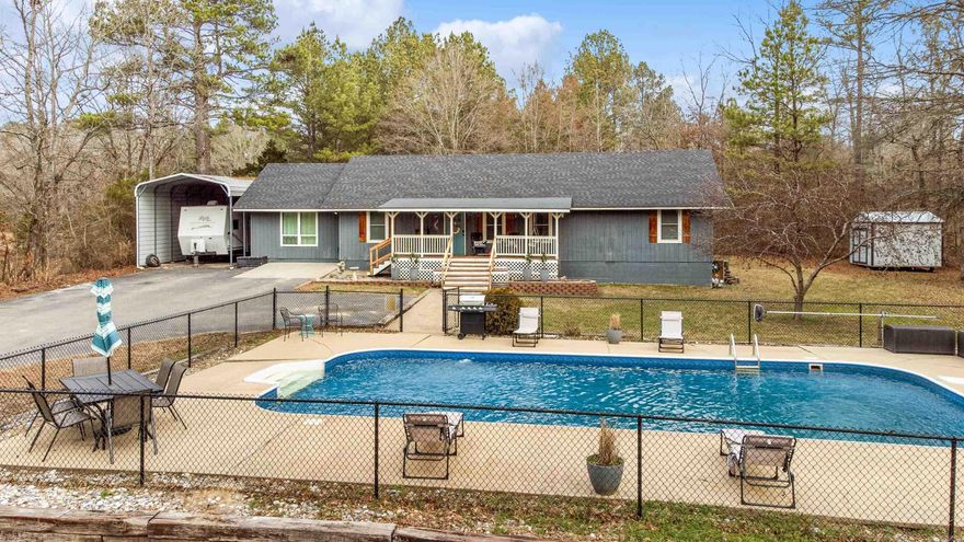 Nestled on 3.27 acres, this beautifully updated 5-bedroom, 3-bath home offers the perfect blend of privacy, space, and modern comfort. Surrounded by nature in a serene country setting, you’ll enjoy peaceful living with room to spread out—inside and out.  Recent updates provide peace of mind and stylish finishes throughout, including a new roof (2024), HVAC (2021), new windows, new flooring, fresh interior and exterior paint, hardware, updated bathroom vanities, and a new kitchen backsplash. The all-electric home features a functional layout with spacious bedrooms, a small pantry for added storage, and thoughtful upgrades throughout.  Step outside to your own private retreat featuring an in-ground pool with liner replaced just over two years ago—perfect for summer entertaining. The property is well-equipped for hobbyists and outdoor enthusiasts with a 30x24 metal shop, covered RV parking, dedicated RV and generator outlet, and an additional storage shed.  If you’ve been searching for space, privacy, and move-in-ready updates—all surrounded by woods—this one checks every box. Enjoy country living with modern conveniences already in place.