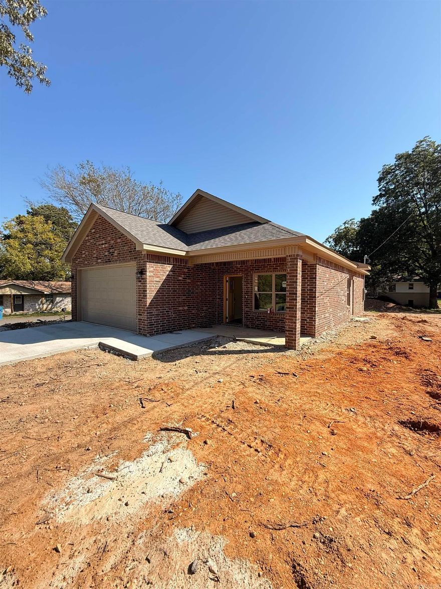 New all-brick construction on a level lot! This 3BR/2BA, 1,253 sq ft home offers a vaulted ceiling in the kitchen and living area, large pantry, granite countertops, and custom cabinetry. Each bedroom features a walk-in closet, plus there’s a spacious laundry room and two-car garage. Built with spray foam insulation for efficiency and a wheelchair-accessible design for convenience. Includes a 1-year builder’s warranty—move-in ready!  Home is located a short commute to Hot Springs and Oaklawn Racing. 30 minutes from Benton, Bryant, Henderson State University, Ouachita Baptist University, DeGray Lake, and several State and National Parks. Less than a hour from downtown Little Rock with an easy commute!
