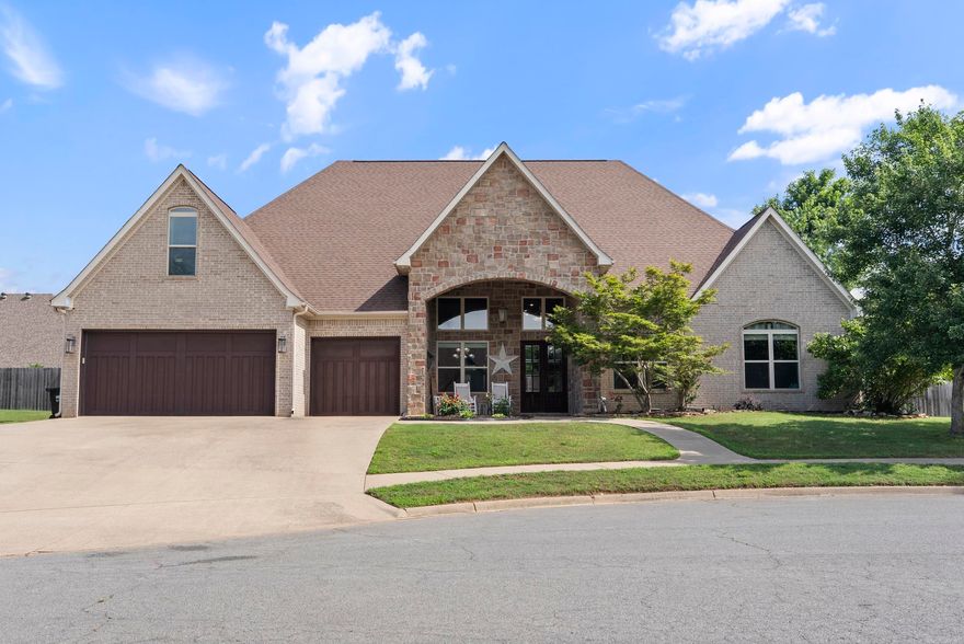This stunning home offers over 3,800 sq ft of thoughtfully designed living space with room for everyone and everything. The main level features four spacious bedrooms & 2.5 baths, including a luxurious primary suite with a barrel ceiling, a circular walk-in shower, and a generous walk-in closet. Upstairs, you'll find the perfect entertaining setup with a theater room, full bath, fifth bedroom, and bonus space, ideal for a home office, playroom, or guest suite. The chef's kitchen is a true showstopper, equipped with a commercial-size refrigerator, double ovens, updated appliances, a breakfast bar, & an open layout that flows seamlessly into the hearth room with coffered ceilings for an added touch of elegance. Step outside to a fully fenced backyard oasis complete with a covered patio and a fully outfitted outdoor kitchen featuring a sink, mini fridge and freezer, natural gas hookups, and even an outdoor TV, perfect for game days or summer evenings under the stars. This home also features a new roof (2021), new windows (2022), newer HVAC, on-demand hot water heater, & spacious three-car garage. This home offers high-end finishes & a layout designed for comfort & entertaining.