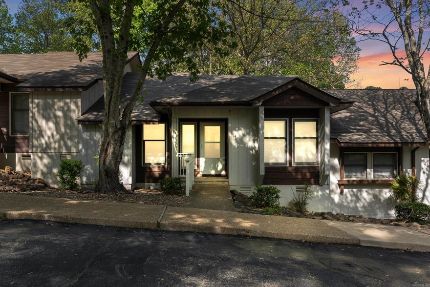 Welcome to 26 Tomisa Lane, nestled in the scenic beauty of Hot Springs Village!  This delightful townhome offers 2 bedrooms and 2 bathrooms in a convenient single-level layout that's perfect for easy living. Step out back to enjoy a peaceful patio space—ideal for relaxing or entertaining. Built in 1984, the home has been well-maintained and thoughtfully updated over the years, blending modern touches with the opportunity to add your personal style. Recent improvements include new carpet, recessed lighting and light fixtures, new stove, Vent-a-hood and dishwasher, and new bathroom and kitchen countertops. As well as a new master bedroom sliding glass door and new front door storm door—making this home truly move-in ready. Located just 5-6 blocks from Lake DeSoto, scenic trails, the golf course, local dining, gas stations, and emergency services, you're perfectly positioned to enjoy everything The Village has to offer. Don't miss your chance—schedule a tour today and envision the laid-back lifestyle waiting for you!