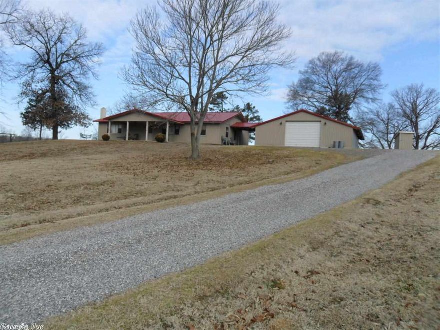 This is a 3 acre parcel at the end of the paved road, sitting on the hill with 592.41 feet of Caddo River Frontage in Pike County, Arkansas.  The home has 1792 sq. ft. with 2 bedrooms, 2 baths, large living room and nice kitchen.  There is central heat and air, and the floors are carpet and tile.  Outside, there is an attached garage (32x40), a covered patio on front, an open patio on end and back, with river views from all.  The views from this property are simply "beautiful", and ends on a dead end road