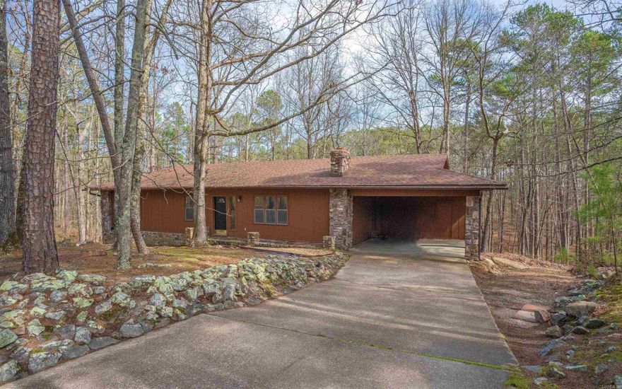 Welcome to your new home nestled in the serene woods! This charming residence features newly installed flooring and light fixtures throughout most of the house, enhancing its appeal. The kitchen boasts a new dishwasher, vent-a-hood, and stove.  The upstairs area is both heated and cooled for year-round comfort, while the basement, which has central heat & naturally stays cool. The spacious basement also offers enough room to add a 4th bedroom and has ample room for a cozy den. Stunning stone fireplace. Pella windows on main level. The property includes four outbuildings at the rear of the property, ideal for workshops or additional storage. Relax on the deck and take in the sights and sounds of the wildlife in this peaceful setting. A new roof was installed in October 2022. AGENTS SEE REMARKS