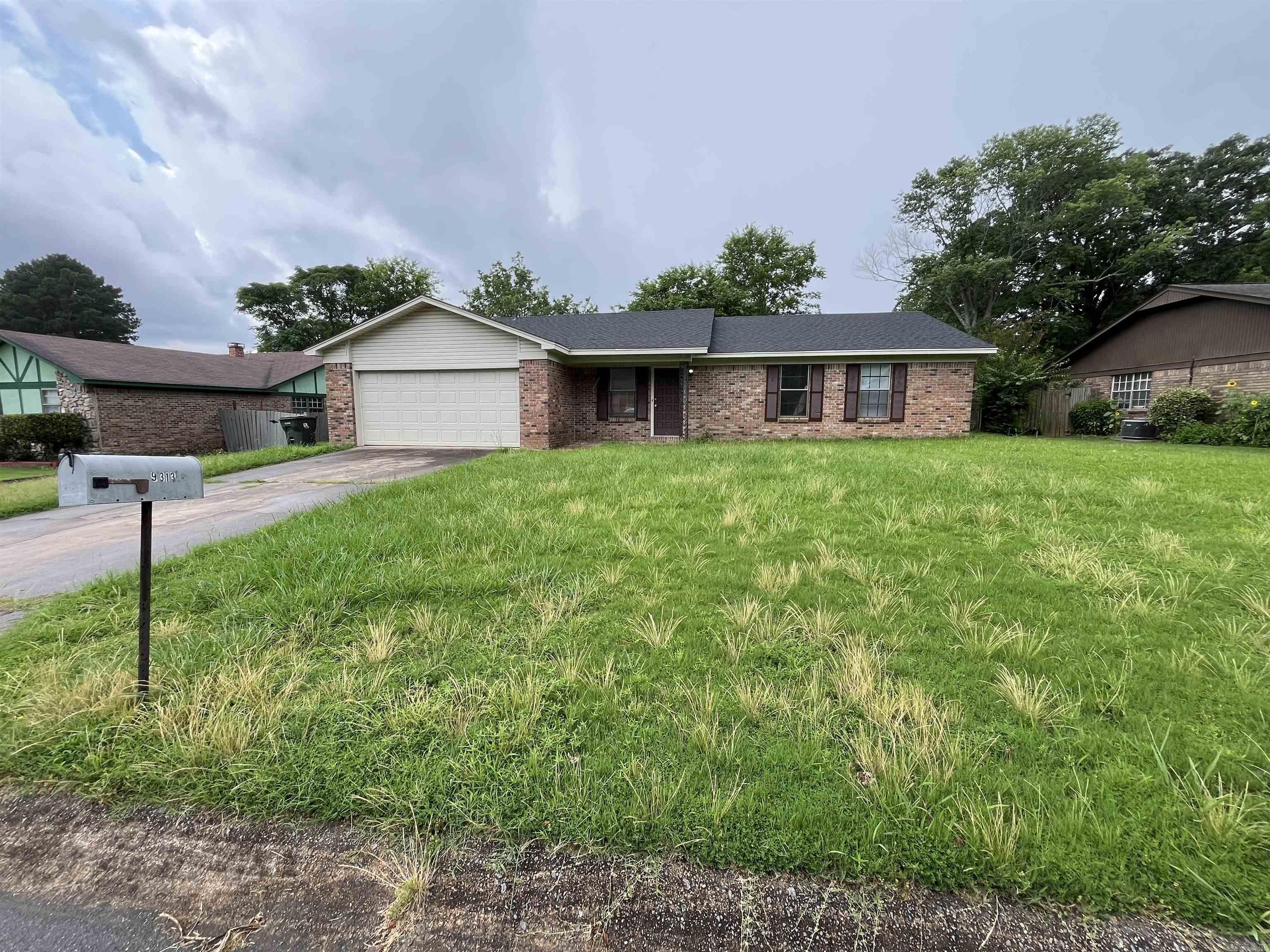 Fixer Upper 3 Bedroom 2 Bathroom brick house with 2 car garage and fenced in back yard. Selling AS-IS.