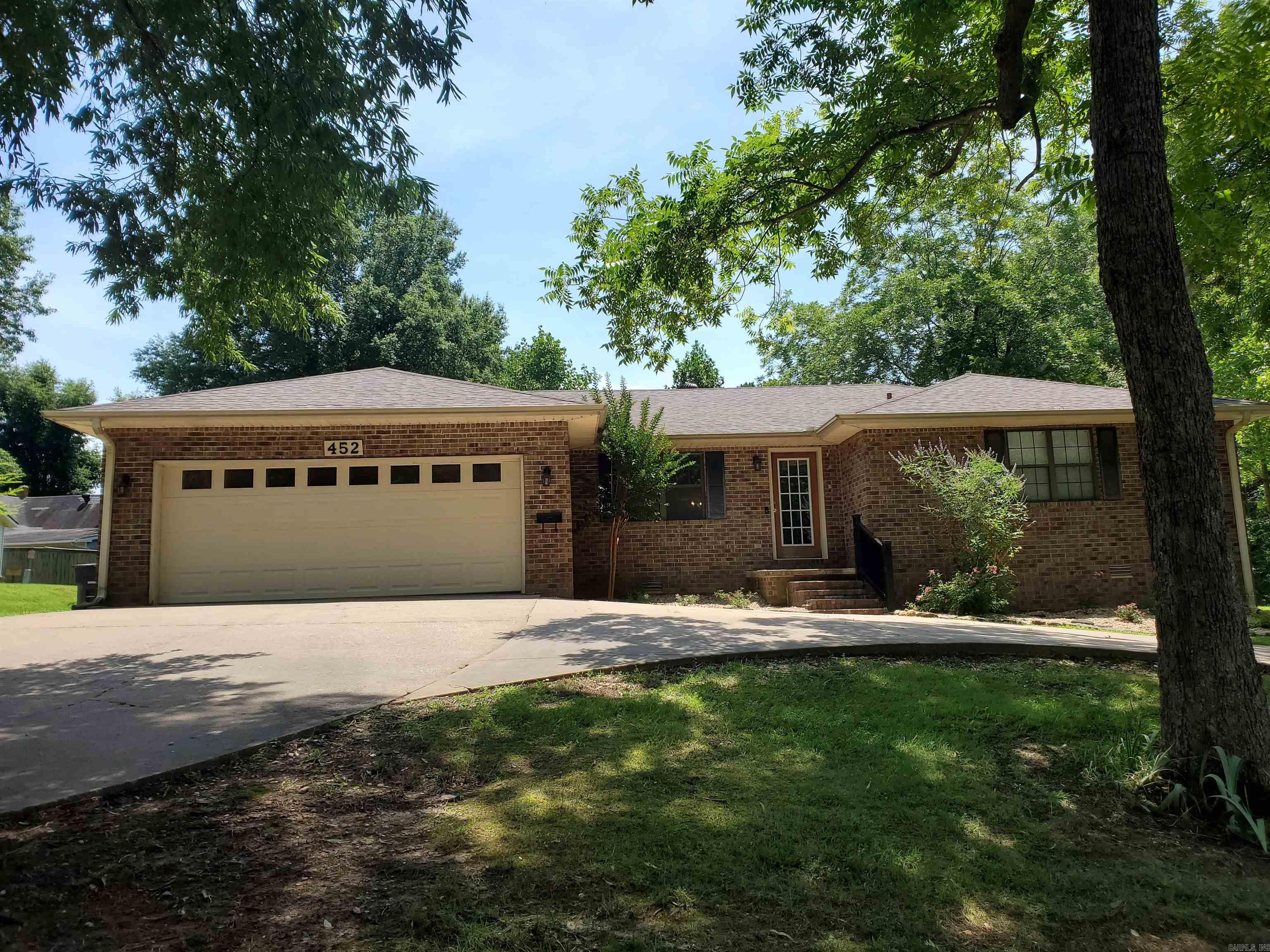452 Pine Tree Lane in Piggott, AR. Is a stunning 3-bedroom, 3-full bath, 2,089-sqft brick home nestled on a 0.40-acre lot in the quiet cul-de-sac of Cole's subdivision. This spacious house with open is absolutely perfect for a growing and busy family! This property is a must see!!