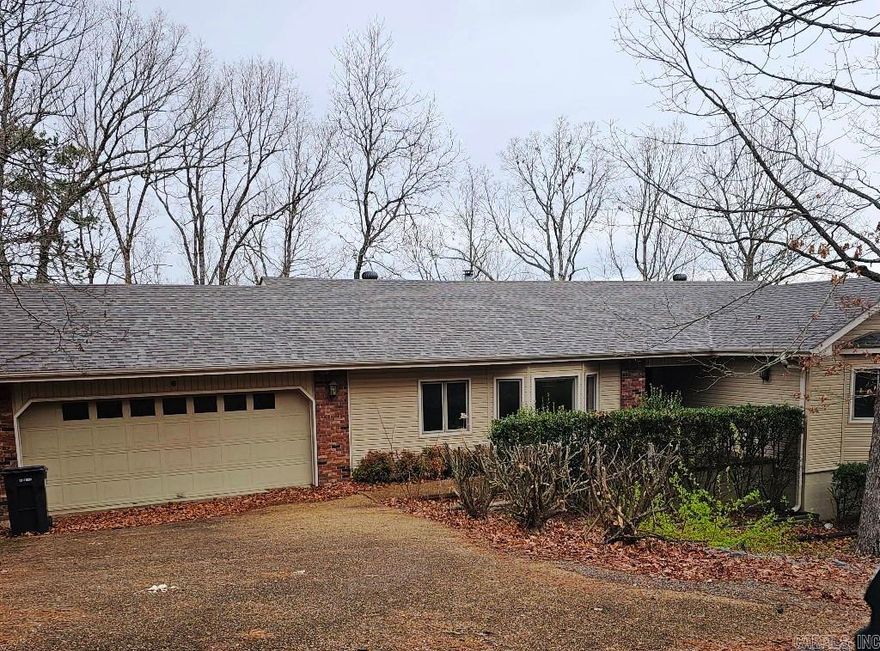 One Level 3 bdrm, 2 Bath home with seasonal view. Fireplace and 2 car garage. Large laundry room. Storage Under Home.