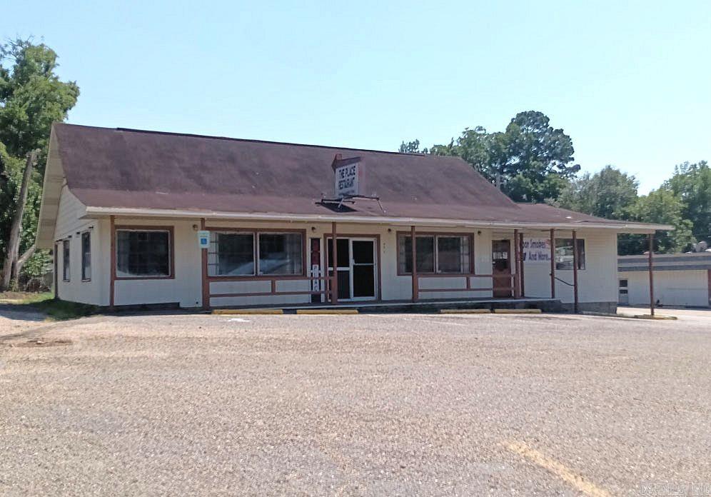 Commercial building with two separate business spaces. The building has been used as a restaurant since the 70's. The private dining area was converted to a retail store in 2023. It can easily be converted back to a large dining area. The dining room furniture tables, booths, counter stools and chairs are to remain with the building, as well as all of the kitchen equipment, appliances, freezers, office furniture and dishes. The restaurant also includes a grease trap and kitchen exhaust. It is on a busy street with a lot of drive by traffic. It's the perfect location for a family style restaurant. It should be possible to add a drive through window on the west side of the building. If you're ready to start your own restaurant, you should consider this opportunity.