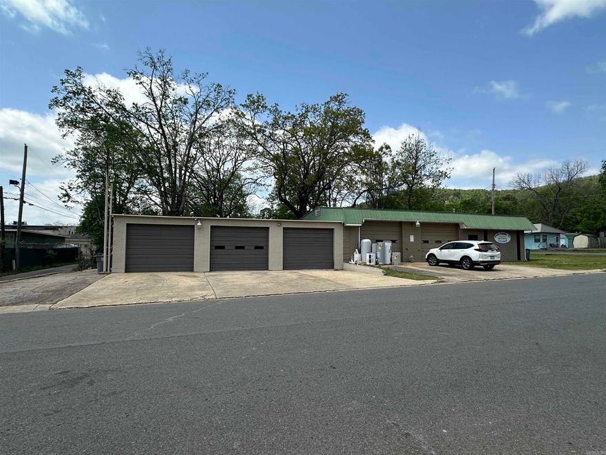Need a garage? This one is ready to work in from day one! Featuring approx. 1,440 sq ft of heated & cooled space, this fully updated garage includes a new roof, fresh interior & exterior paint, bright new LED lighting, and 3 bay doors plus a side entry door for easy access. Inside you’ll find a bathroom and an air compressor already in place—ideal for a variety of uses. Whether you're looking to start or expand a business, this space has serious potential. Buyers should verify city zoning to ensure their business plans are permitted and confirm building & lot square footage as part of due diligence. Seller may consider owner financing on a portion of the sale. Come check it out—this garage is move-in ready and waiting for your next venture!---Agent See Remarks for Owner Financing Details