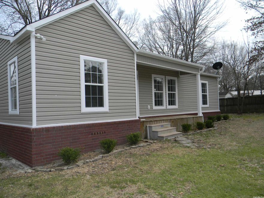 This charming 3 bedroom, 2 bath home has been freshly remodeled and improvements made. It has hardwood flooring almost throughout, master bedroom has carpet, spacious closet and bath,  There's also a large laundry room.  It also has a porch and sits on a nice size lot.  Property corners have been set.  It is awaiting its new owner to add final touch.