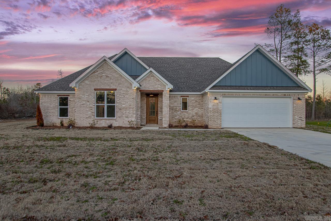 Welcome to this beautiful 4-bedroom, 2-bath home, nestled on just under 2 acres right outside the city limits. With a blend of modern design and cozy charm, this home features an open floor plan and custom finishes throughout. The spacious master suite is designed with relaxation in mind, offering a walk-in closet, a freestanding tub, and a walk-in shower. The living room boasts a gorgeous accent wall, complete with a gas fireplace and wood mantle, adding warmth and charm to the space.Step outside to a covered back patio that overlooks your private backyardāideal for peaceful mornings or weekend entertaining. This home is a must-see!