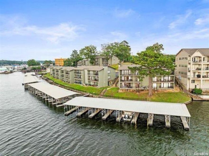This 7 south level entry condo on Lake Hamilton allows short term rentals. This unit is located in the coveted 9 building at the Landing, which has the best views of  the main channel.  You can watch the seasonal fireworks show directly from your balcony. Comes with everything including a boat slip. Owner/agent