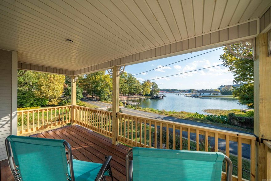 WOW!! WHAT A CAPTIVATING VIEW OF GORGEOUS LAKE HAMILTON!! A unique home hosting a lovely remodel and shiny clean interiors, features this view and much more!! This amazing townhome is beautifully positioned where you are able to enjoy watching the festive Lake Hamilton Fireworks!!! Gleaming LVP Flooring and windows all thru out the home!!! In the heart of the Living Room there is a huge, cozy Fireplace to nestle next to during the upcoming Holiday Season! The 1830 sq ft with 3 bedrooms and 3.5 baths, includes large, top-level Master Suite!! There is room for everyone!! Home offered as partially furnished!! Lets Tour!!!!