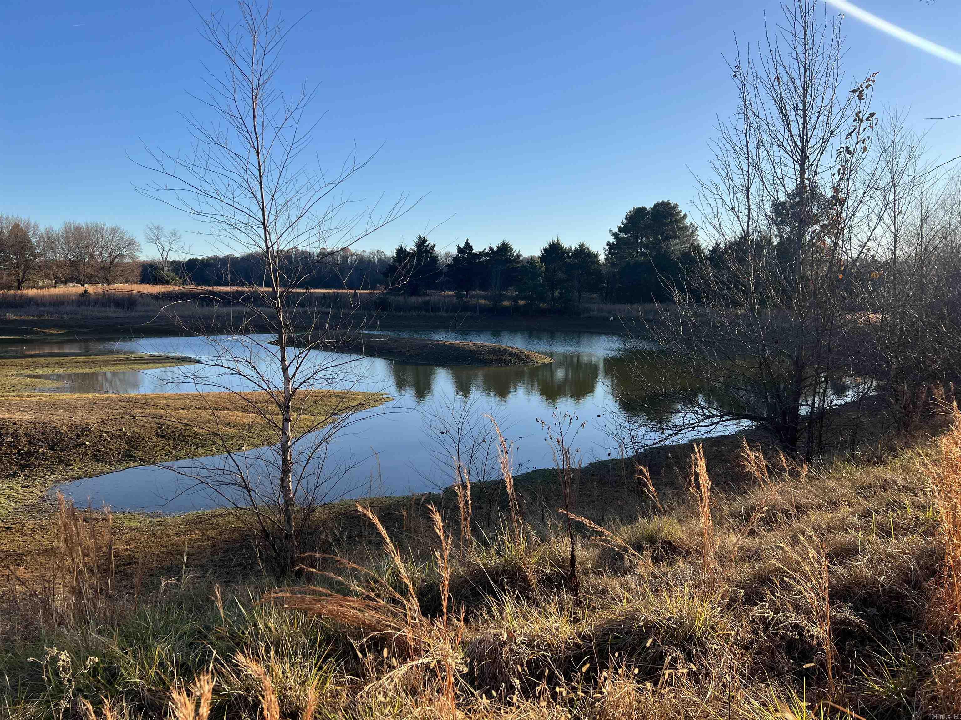 Pond, shop, barn,8.49 acres, and a 1925 built old house. The house could be redone or just start over with your own house, Lots of possibilities. This place has a great 30x 50 shop with roll up door, old barn with a loft, rock well house, and old shed. The house is need of alot of work with bad floors in most of the downstairs. The property needs a good cleanup to see all the extra. There is a well in the well house and we found another well between the house and the pond. Seller will review all offers on Dec 23rd . Please have all offers to listing agent before 8 am on Dec 23rd. Seller will try to decide by noon that day.