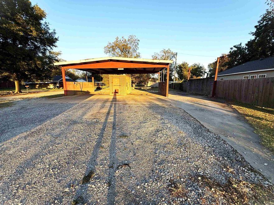 Use your imagination!!!  This property was formerly a car wash, but new buyer will be restricted from having a car wash on this property for 15 years.  There is a 1000 sq ft covered space as well as a brick closet.  The lot is approximately 70 x 100.