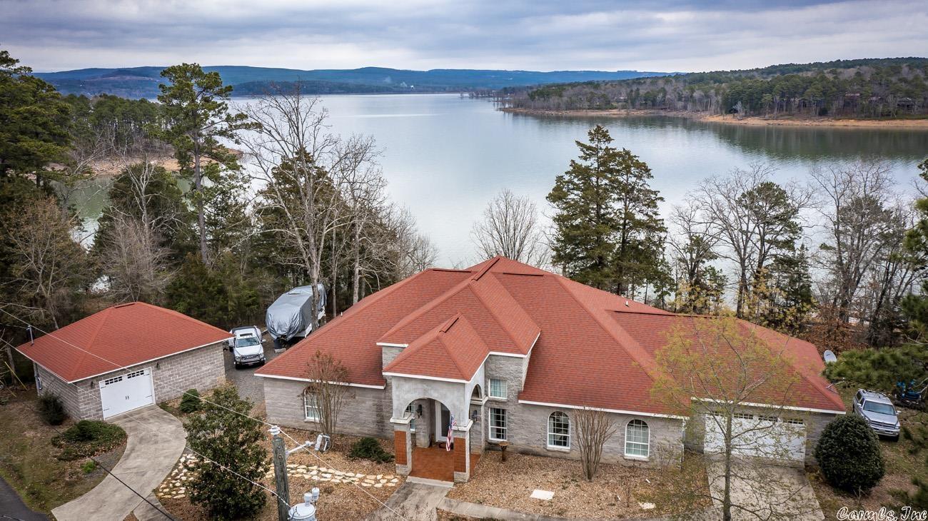 Just had recent appraisal completed on 4/20/2022 value at $690,000.This is a Solid,Well Built Lake Front Home on "The Narrows".Seller has Built this home as his forever home, but yet things have changed & they are moving closer to family.The White Line is low & very close to the Water Line so you have a Lake View from your Master Suite,plus an easy walk to the shoreline.24x30 attached garage & 24x30 detached shop.New Custom Made window treatments installed throughout home that will stay.Gas Range & gas FP.