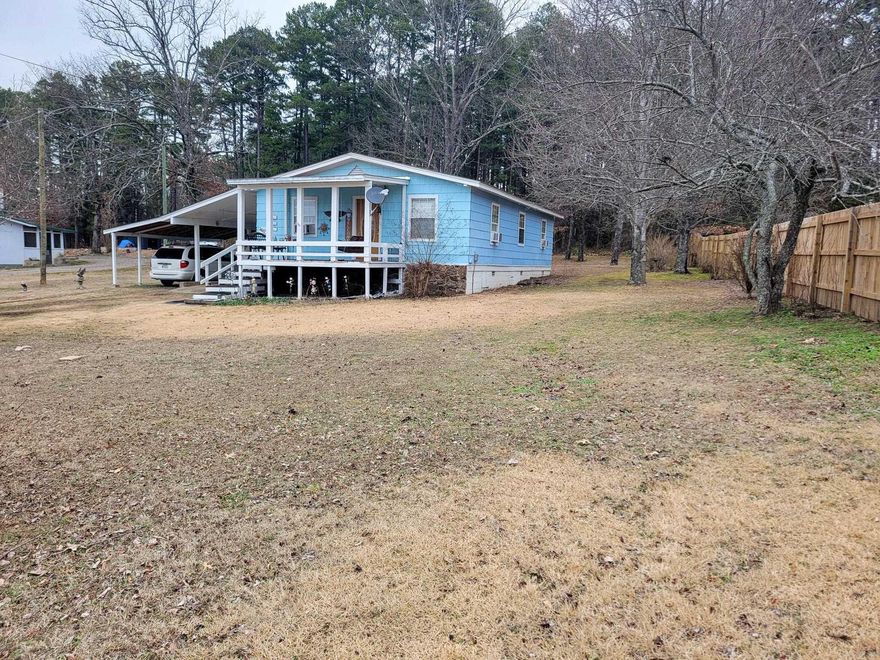 This house is located close to coveted Fairfield Bay. This home has been well maintained, though being built in 1981.  There have been some remodeling done, including floor and deck. Propane tank has been filled recently. The owners are handicapped so this house is built for that. It's on a .4 acre lot with plenty of room spread out. Just 5 minutes away from the lake!  And it features a new roof! The layout of the home is built for relaxation and also an inviting environment. This home could be a perfect get-a-way or a perfect residence! Schedule your showing today!