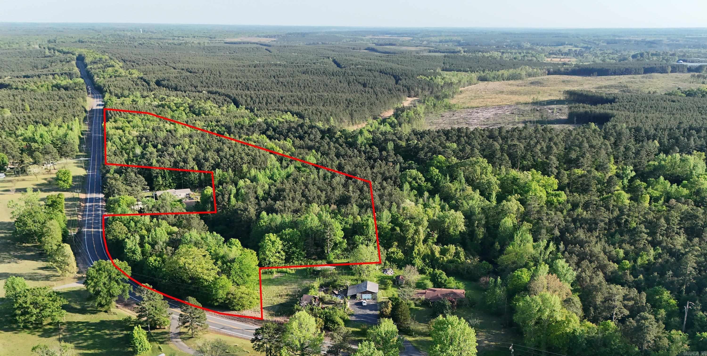 Beautiful wooded acreage, with highway frontage and conveniently located 10 minutes from the interstate. Land is located in Hot Spring County without restrictions.