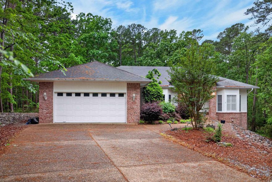 Welcome to 40 Belleza Trace---a beautifully appointed brick and siding home nestled on a quiet cul-de-sac lot with seasonal views of Ponce de Leon golf course. With 2272 sq ft of thoughtfully designed living space, this 3 bedroom, 2.5 bath split plan offers a perfect blend of elegance and comfort in the heart of HSV. Soaring vaulted ceilings with skylights and a gas log brick fireplace and the kitchen fill the home with natural light, while lvp floors flow through the primary bedroom and main living areas. 2 additional bedrooms are carpeted.  The gourmet kitchen is a chef's delight featuring tile countertop, tiled floor, a walk-in pantry, under cabinet lighting, garbage disposal and rollouts.  All kitchen appliances convey. The spacious primary suite boasts lvp floors, a large walk-in closet, dual vanities, and a beautiful tiled shower with bench. A large laundry room with lots of built in storage. Step outside to a full length deck with one section covered with ceiling fan - the perfect spot tp enjoy seasonal views of golf course. The hot tub conveys with home, making this an entertainer's dream