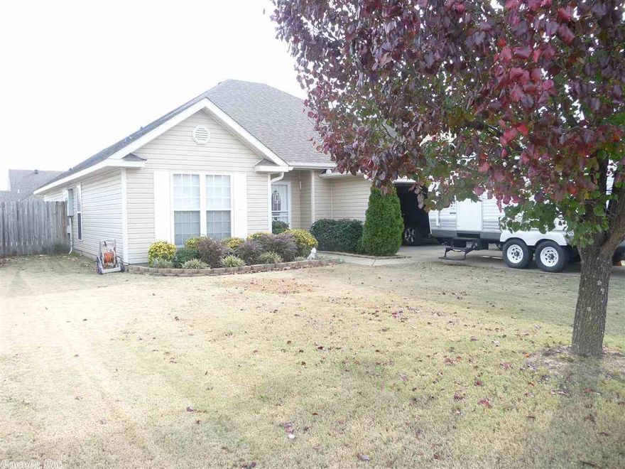 Wonderful 3 bedroom 2 bath, split floor plan. The eat-in kitchen features lovely cabinets with breakfast bar, a window wall, ceramic backsplash and stainless appliances. Vaulted ceilings, neutral wall color, 2" wood blinds and beautiful laminate floors in the living room and all 3 bedrooms create a spacious feeling throughout. The master bathroom is large with double sinks, a corner jetted tub, vanity area and separate stall shower. There are so many extras to love about this home, especially the windows!