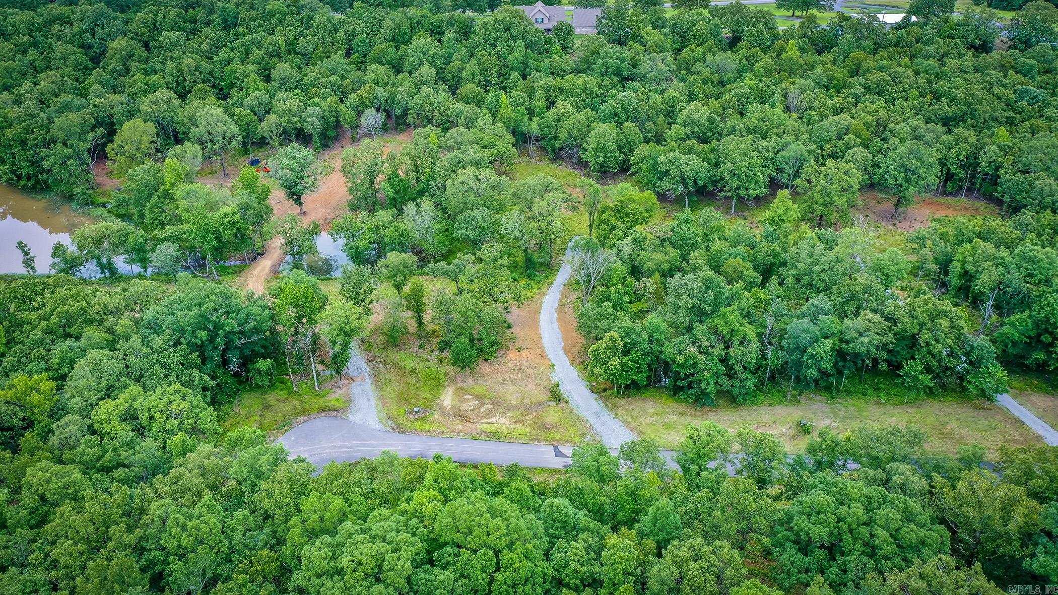 One of the last flat lots left in Mountain Ranch Estates. This one has utilities at road and driveways already in! Ready to build your dream home in this gated subdivision just minutes from town. Over two acres to enjoy. Can be purchased with lot 104 for over 4.5 acres!