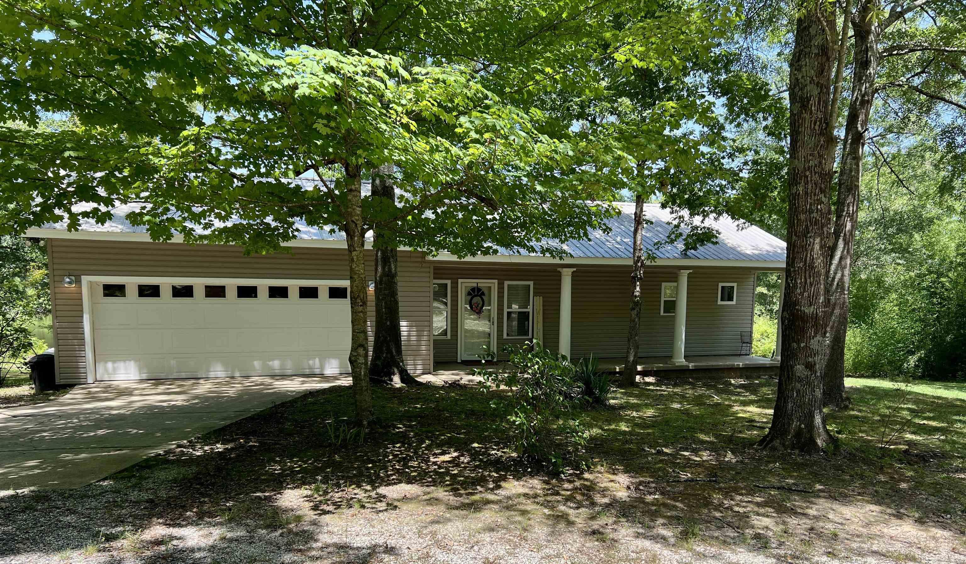 Nestled just minutes from both Henderson State University and Ouachita Baptist University, this 10-acre property offers a perfect blend of convenience and natural serenity. The well-kept 1-bedroom, 1-bathroom home sits on a gentle rise overlooking a beautiful 3-acre stocked pondāideal for peaceful mornings or relaxing evenings on the back deck. Designed with an open floor plan, the home feels spacious and inviting, with scenic views that bring the outdoors in. A portion of the garage has been thoughtfully converted into a large storage room, providing extra functionality without sacrificing space.